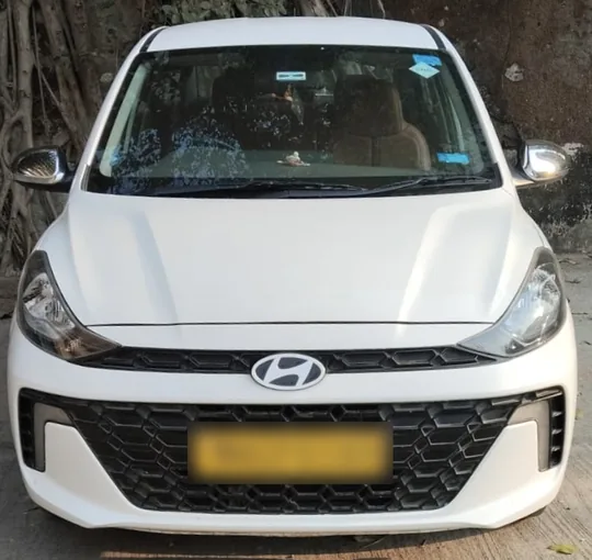 Hyundai Aura sedan chauffeur driven Mumbai