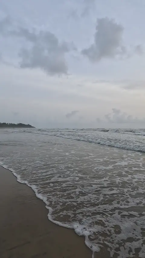 Waves running up Tarkarli beach, Malvan