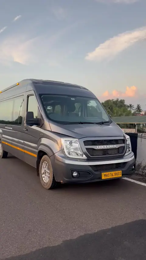 Grey Force Urbania, front view, available on rent with driver from Konkan Central