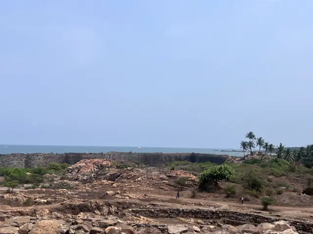 Rocky coast and palms seen from Sindhudurg Fort